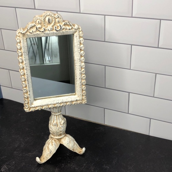 Vintage cream aged iron mirror on stand